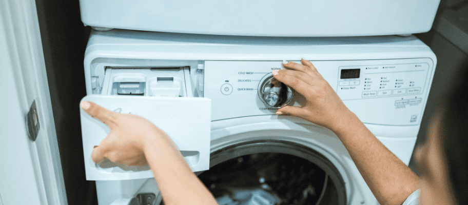 Putting detergent in washing machine