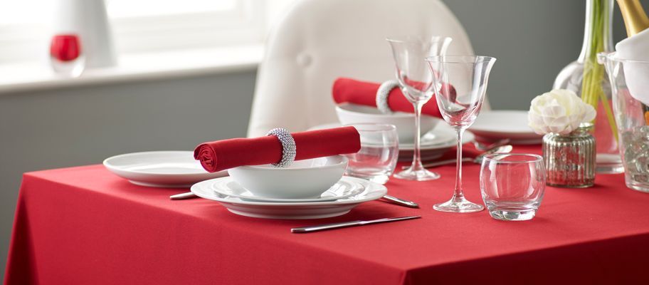 Red polyester tablecloth with table setting