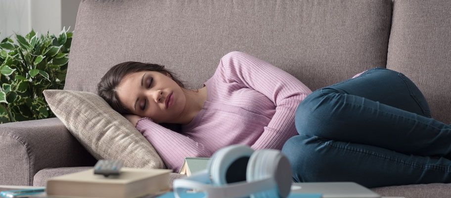 woman sleeping on couch