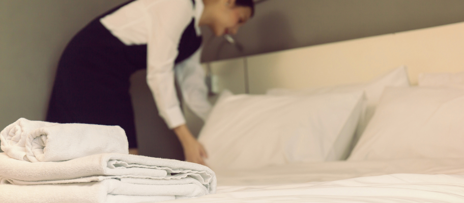 Hotel bed with fresh bed and bath linens