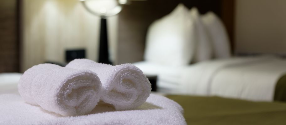 White bath towels on hotel bed