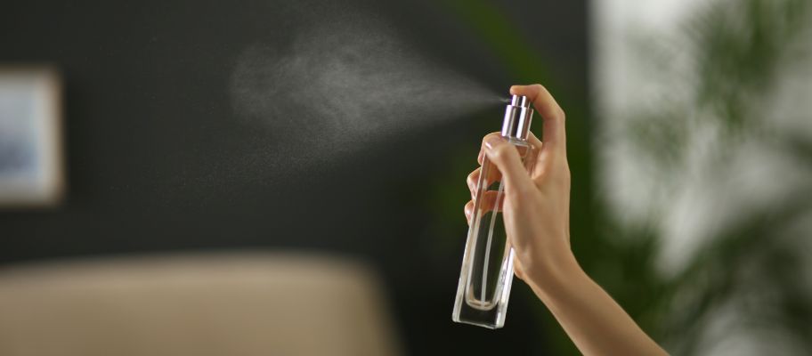 Woman spraying a room
