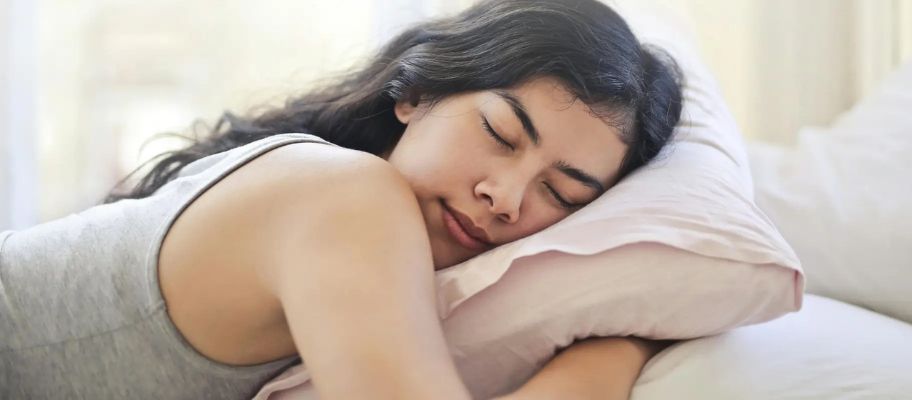 Young woman sleeping n bed
