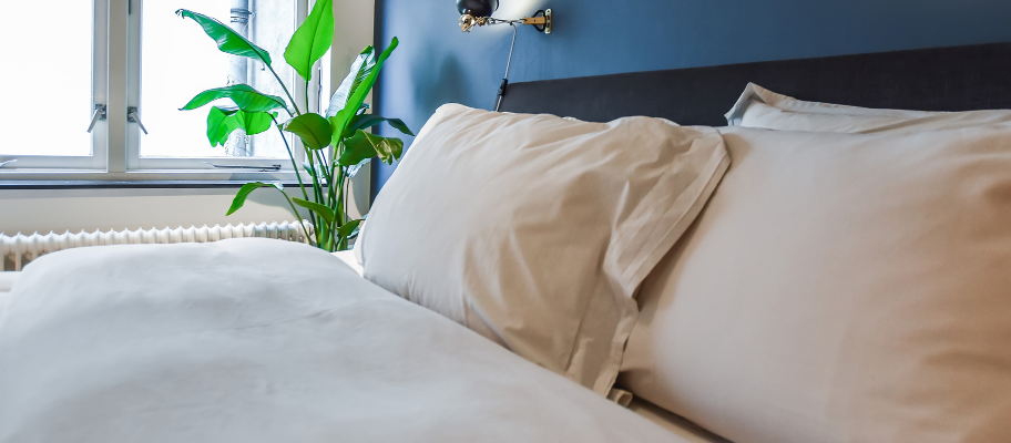 Cosy bedroom with white bed linens
